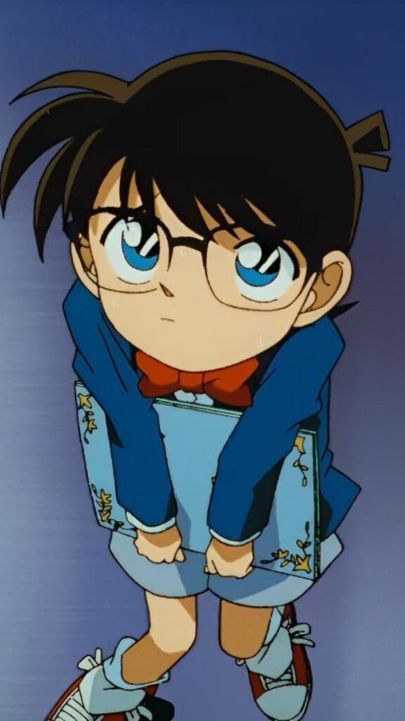 Conan chibi cúi người với ánh mắt tò mò