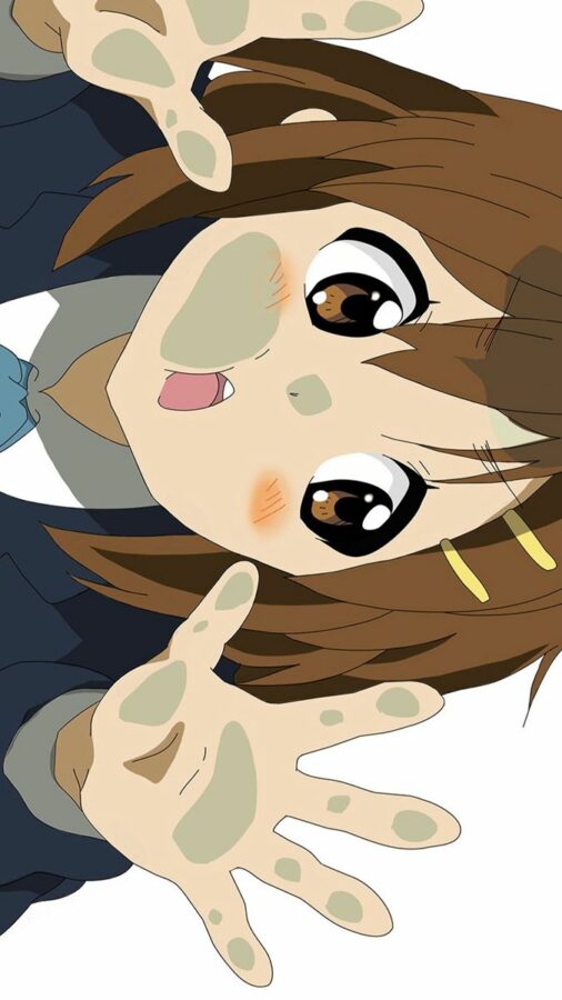 Nhân vật anime mắt to tạo dáng với hai tay giơ cao